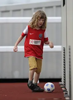 Framed Print : Young Fan's Thrill at FA WSL Match: BAWFC vs Arsenal Ladies