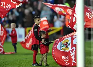 Swindon Prints: Young Flag Bearer Assisted at Bristol City vs Swindon Town Football Match, April 2015