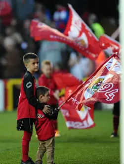 Swindon Prints: Young Flag Bearers Assisting Each Other at Bristol City vs Swindon Town Match, April 2015