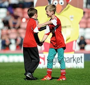 Images Dated 18th April 2014: Young Rivals Leo Worlock and Luca Fortuna: Celebrating Bristol City's Victory with Unmatched