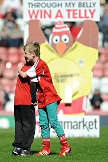 Images Dated 18th April 2014: Young Rivals Leo Worlock and Luca Fortuna: Celebrating Bristol City's Victory with Unmatched